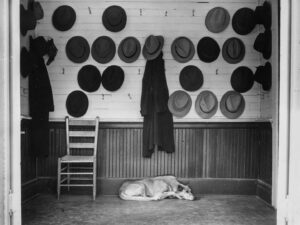 John Vachon (1915-1975), The vestibule of the Baptist church during Sunday services with hats hanging on the wall. They belong to parishioners who are mostly steel and cotton workers. Gadsen, Alabama.December, 1940 gift of Jim Gattis