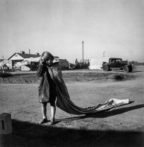 Dorothea Lange (1895 - 1965). The Arvin migratory farm workers' camp of the Farm Security Adminitration. Young cotton picker. Kern County, California. November 1936.
