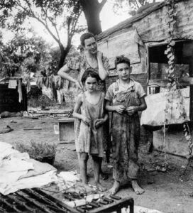 Dorothea Lange (1895 - 1965). People living in poverty in a shacktown for agricultural workers. Elm Grove, Oklahoma County, Oklahoma. August 1936. Gift of June Korntvtid Deome.