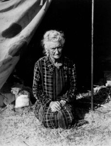 Dorothea Lange (1895 - 1965). Grandmother of twenty-two children, from a farm in Oklahoma; eighty years old. Now living in camp on the outskirts of Bakersfield, California. "If you lose your pluck you lose the most there is in you - all you've got to live with." Bakersfield, California. November 1936.