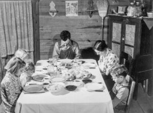 Jack Delano (1914 - 1997). Smith family saying grace at the afternoon meal. Carroll County, Georgia. April 1941. Gift of Bette Winthurs, Salinas, CA.