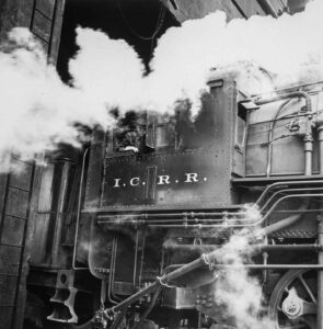 Jack Delano (1914 - 1997). Locomotive picking up coal at an Illinois Central railroad yard before going out on the road. Chicago, Illinois. November 1942.