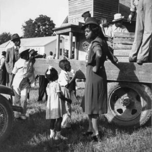 Marion Post Wolcott (1910 - 1990). A group of Negroes beside a soft drink and ice cream truck; the children are eating ice cream cones. Natchitoches, Louisiana. June 1940.