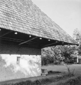 Marion Post Wolcott (1910 - 1990). The "African" house, probably a storeroom, smokehouse, or jail when it was built by mulattoes. It belonged to the Yucca plantation and is now a part of the John Henry plantation. Melrose, Louisiana. August 1940. Gift of Joe and Jewel McMillan, Salinas, CA.