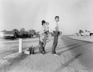 Dorothea Lange (1895 - 1965). Example of self-resettlement in California. Oklahoma farm family on highway between Blythe and Indio. Forced by the drought of 1936 to abandon their farm, they set out with their children to drive to California. Picking cotton in Arizona for a day or two at a time gave them enough for food and gas to continue. On this day, they were within a day's travel of their destination, Bakersfield, California. Their car had broken down en route and was abandoned. Highway between Blythe and Indio, California. August 1936.