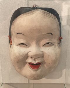 Noh Mask of Okame Painted wood, 19th or early 20th Century. Gift of Robert Skiles.
