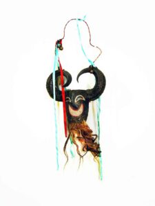 Chivo (Goat) Mask, 27" x 12" x 4", sculpture, carved wood, paint, horn, hair, wire, ribbon, artist unknown