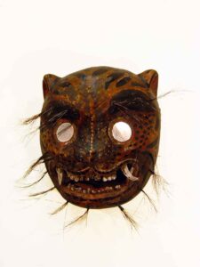 Tigre (Jaguar), 12" x 12" x 7", sculpture, carved wood, paint, tusks, hair, mirrors, artist unknown